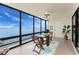 Enclosed sunroom boasts floor-to-ceiling windows offering panoramic views of the water at 1750 Jamaica Way # 312, Punta Gorda, FL 33950