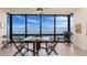 Enclosed sunroom boasts wall-to-wall windows offering panoramic views of the bay at 1750 Jamaica Way # 312, Punta Gorda, FL 33950