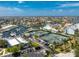 Aerial view of tennis courts near a residential community and boat docks at 1750 Jamaica Way # 312, Punta Gorda, FL 33950