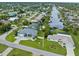 Aerial view of the property showing location on canal with boat docks and lush landscaping at 18652 Ohara Dr, Port Charlotte, FL 33948