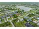 Aerial view of a residential area with a lake, showcasing waterfront properties and green spaces at 18652 Ohara Dr, Port Charlotte, FL 33948