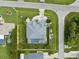 Aerial view with property lines, showcasing a private pool and lush landscaping on a well-maintained lot at 18652 Ohara Dr, Port Charlotte, FL 33948
