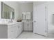 Bathroom featuring double sink vanity, elegant mirrors, and marble floors at 18652 Ohara Dr, Port Charlotte, FL 33948