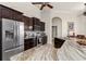 Spacious kitchen with marble counter tops, stainless steel refrigerator, and dark wood cabinetry at 18652 Ohara Dr, Port Charlotte, FL 33948