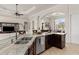 Modern kitchen with granite countertops, stainless steel dishwasher and sink overlooking the living area at 18652 Ohara Dr, Port Charlotte, FL 33948