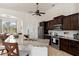 Gourmet kitchen with an eat-in island, granite countertops, and stainless steel appliances at 18652 Ohara Dr, Port Charlotte, FL 33948