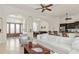 Open-concept living room with tile flooring, access to the kitchen, and a view of the entryway at 18652 Ohara Dr, Port Charlotte, FL 33948