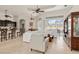 Bright living room featuring high ceilings, tile floors, and access to lanai at 18652 Ohara Dr, Port Charlotte, FL 33948