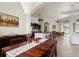 A wide view of the living and dining area with high ceilings and views of tropical landscaping at 18652 Ohara Dr, Port Charlotte, FL 33948