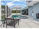 Enclosed pool area with hot tub and furniture at 18652 Ohara Dr, Port Charlotte, FL 33948