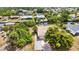 Aerial view of home surrounded by lush greenery, showcasing the spacious yard and desirable location at 18753 Klingler Cir, Port Charlotte, FL 33948