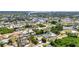 Scenic aerial view of canal-front homes in a waterfront community surrounded by lush green trees and natural waterways at 18753 Klingler Cir, Port Charlotte, FL 33948