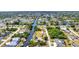 Aerial view of property showcasing waterfront location with canal access and pool at 18753 Klingler Cir, Port Charlotte, FL 33948