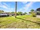 Spacious backyard featuring lush lawn and access to a private boat dock at 18753 Klingler Cir, Port Charlotte, FL 33948