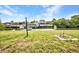 Spacious backyard, green grass, and dock over the water at 18753 Klingler Cir, Port Charlotte, FL 33948