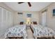 Bedroom features twin beds, closet, and windows with blinds at 18753 Klingler Cir, Port Charlotte, FL 33948