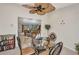 Dining area with glass table and seating for four, open to the living area at 18753 Klingler Cir, Port Charlotte, FL 33948