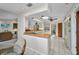 Open kitchen and living room layout featuring white cabinets and wood countertops at 18753 Klingler Cir, Port Charlotte, FL 33948