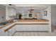 Open kitchen features wood countertops, and a seamless transition to the living area at 18753 Klingler Cir, Port Charlotte, FL 33948