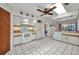 Spacious kitchen featuring white appliances, plenty of counter space, and natural light at 18753 Klingler Cir, Port Charlotte, FL 33948