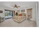 Comfortable main bedroom with private patio access and ceiling fan at 18753 Klingler Cir, Port Charlotte, FL 33948