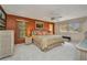 Inviting main bedroom with warm tones, ceiling fan, and serene views through the windows at 18753 Klingler Cir, Port Charlotte, FL 33948