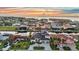Stunning waterfront home with lush landscaping, a private dock, and breathtaking sunset views over the water at 19 Sabal Dr, Punta Gorda, FL 33950