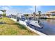 Jet ski and boat on a lift for easy water access to waterway at 19 Sabal Dr, Punta Gorda, FL 33950