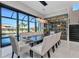 Bright dining room featuring modern chandelier, and a glass enclosed wine cellar at 19 Sabal Dr, Punta Gorda, FL 33950