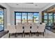 Elegant dining room features a modern chandelier and a large window with waterfront views at 19 Sabal Dr, Punta Gorda, FL 33950