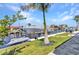 Watercraft at a private dock with lush landscaping and waterfront views at 19 Sabal Dr, Punta Gorda, FL 33950