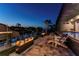 Waterfront property with a modern fire feature and seating next to the outdoor pool at 19 Sabal Dr, Punta Gorda, FL 33950