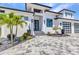 This home features a paved driveway, an attached two car garage, and desert landscaping at 19 Sabal Dr, Punta Gorda, FL 33950