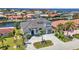 Beautiful aerial of the two story home with a driveway and tropical trees at 19 Sabal Dr, Punta Gorda, FL 33950