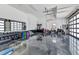 Large garage featuring gym, motorcycles, work bench and car charging station at 19 Sabal Dr, Punta Gorda, FL 33950