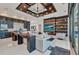 Comfortable living room with modern shelving, fireplace, and a decorative ceiling design to provide a great look at 19 Sabal Dr, Punta Gorda, FL 33950
