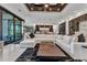Open-concept living room boasts modern design, sleek lighting, and seamless flow to the kitchen and dining areas at 19 Sabal Dr, Punta Gorda, FL 33950