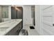 The bathroom offers and sinks, sleek cabinets, a glass shower, and modern decor at 19 Sabal Dr, Punta Gorda, FL 33950