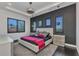 Main bedroom features modern decor, sleek lighting, bedside tables, and window with shutters at 19 Sabal Dr, Punta Gorda, FL 33950