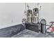 A utility room with two water heaters, water softener and epoxy flooring at 19 Sabal Dr, Punta Gorda, FL 33950