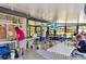 Spacious, light-filled activity room with tables, chairs, and scenic views for community members at 19505 Quesada Ave # A204, Port Charlotte, FL 33948
