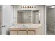 Bathroom vanity with large mirror and cabinets at 19505 Quesada Ave # A204, Port Charlotte, FL 33948