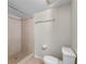 This bathroom features a tiled shower with glass door, and tiled floors at 19505 Quesada Ave # A204, Port Charlotte, FL 33948
