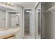 Bathroom vanity with large mirror and access to closet at 19505 Quesada Ave # A204, Port Charlotte, FL 33948