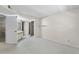 This carpeted bedroom features a closet and bathroom at 19505 Quesada Ave # A204, Port Charlotte, FL 33948
