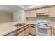 This kitchen features white appliances, light countertops, and ample cabinet space at 19505 Quesada Ave # A204, Port Charlotte, FL 33948