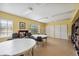 Bright community library with bookshelves, tables, and chairs for a comfortable reading environment at 19505 Quesada Ave # A204, Port Charlotte, FL 33948