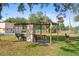 This outdoor shelter features multiple benches, perfect for gatherings and relaxation in a community setting at 19505 Quesada Ave # A204, Port Charlotte, FL 33948