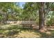 This picnic area features a table, grill, and ample green space for outdoor enjoyment at 19505 Quesada Ave # A204, Port Charlotte, FL 33948