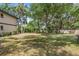 Large grassy backyard with picnic table at 19505 Quesada Ave # A204, Port Charlotte, FL 33948